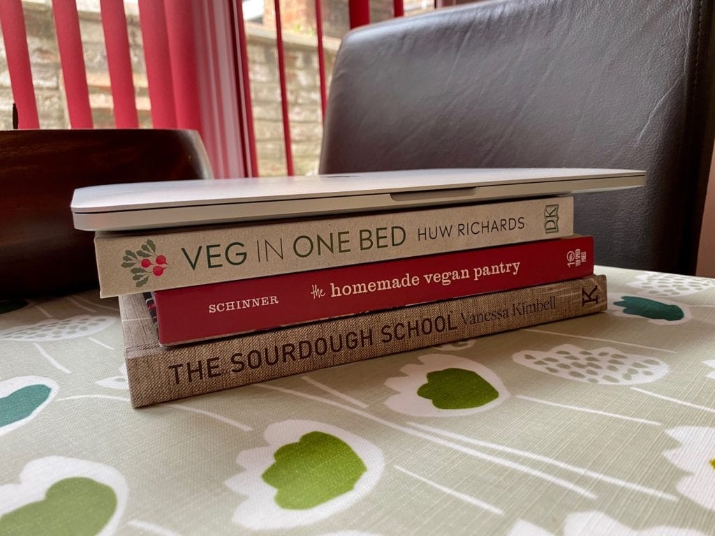 a stack of books sitting on top of a table.