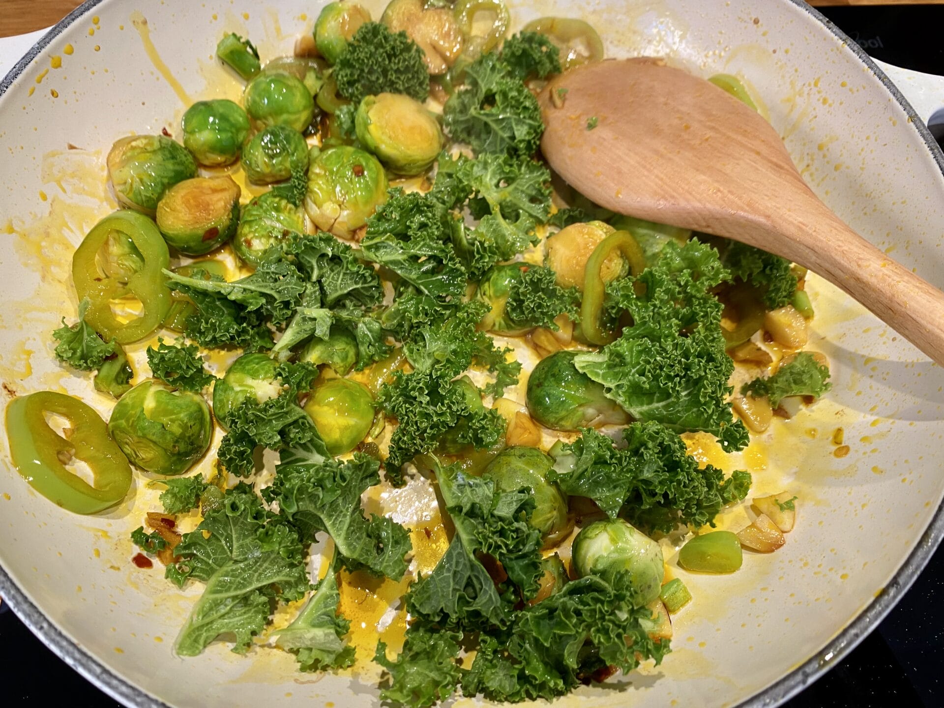 a pan filled with broccoli and brussel sprouts.