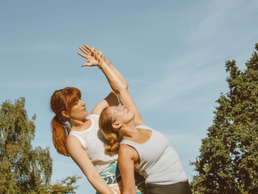 Julia and a student practice yoga in Bedford Park Julia and a student practice yoga in Bedford Park