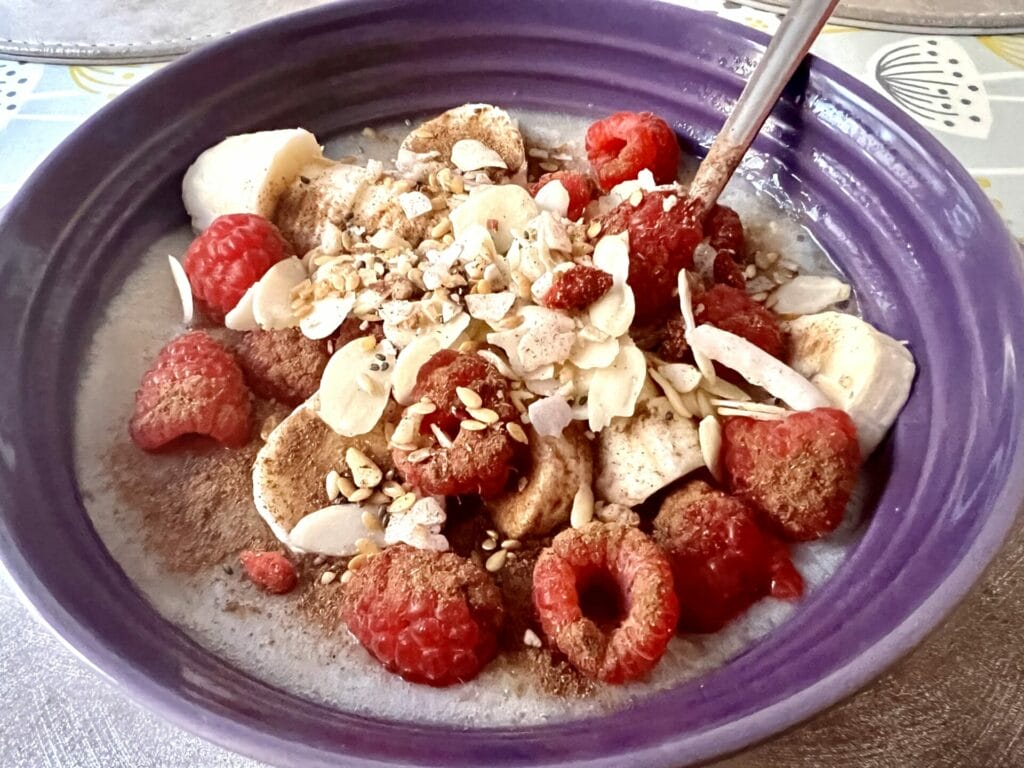 Oat Porridge with nuts and raspberries
