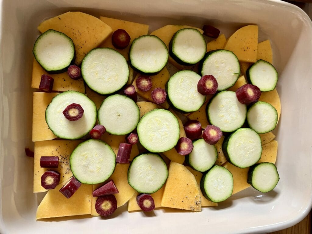 An immune-boosting dish filled with peas in a white baking dish.